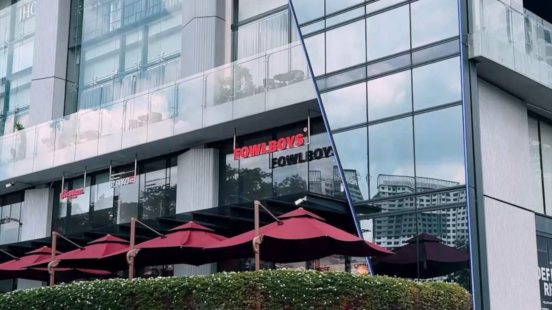 The MET tower in Mont Kiara, the red Fowlboys sign over the terrace and its red umbrellas