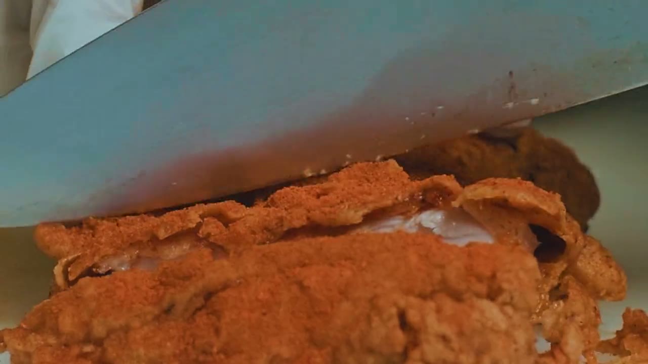 Fried chicken: dredged in seasoned flour, cooling on the rack, dusted with spice, dipped in hot sauce, torn open and plated